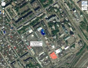 Вид из космоса участка торгового центра ИГОРЬ в Барнауле